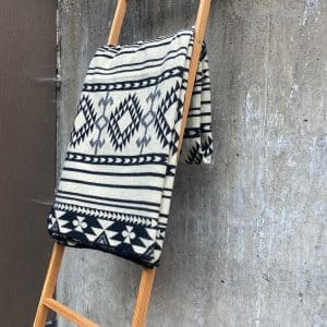 Black & White Throw Blanket with geometric print on a ladder