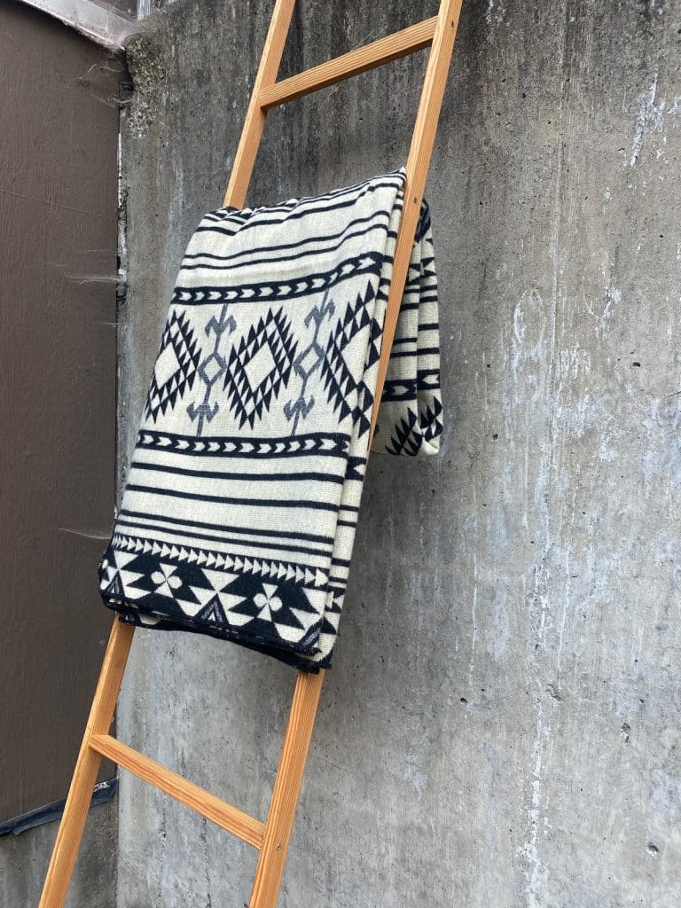 Black & White Throw Blanket with geometric print on a ladder