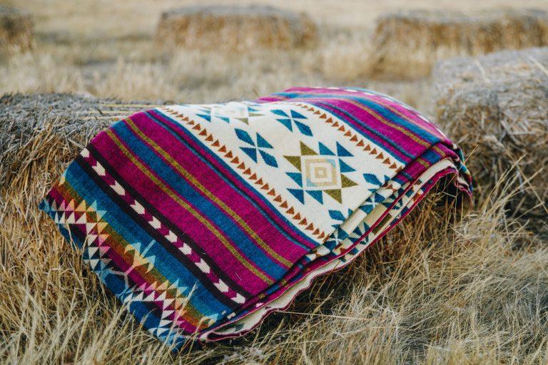 Magenta and turquoise Southwestern print queen blanket