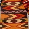 Handwoven native geometric wool rug in earthtones