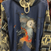 Blue Hoodie with Western Sleeves and Bigfoot figure on front