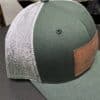 Side view of Oregon leather patch hat on Green Fade Richardson Hat