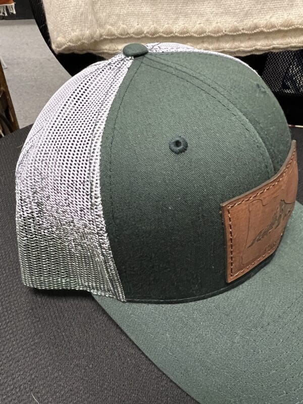 Side view of Oregon leather patch hat on Green Fade Richardson Hat