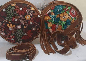 2 different round leather embroidered purses