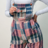 Female model wearing colorful blue pink and green overalls
