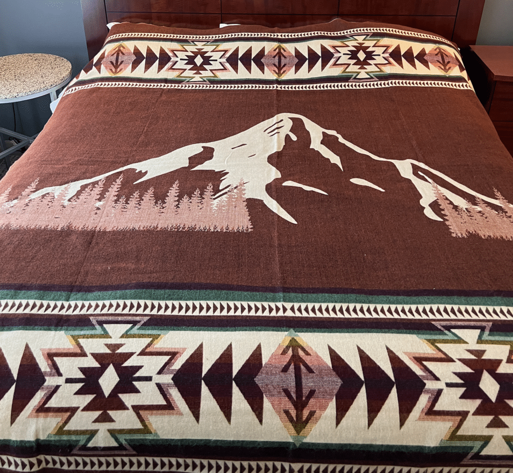 Cinnamon color blanket with image of Mt Hood and geometric border