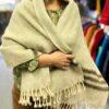 Model wearing taupe wool wrap with 3 dark stripes