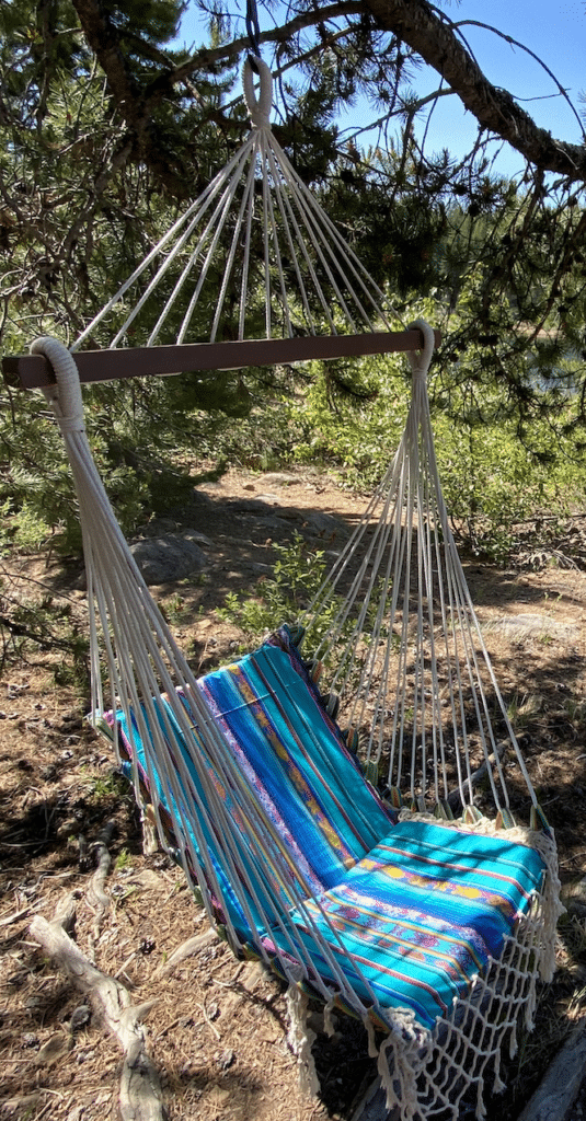 Turquoise hanging hammock chair with cord fringe