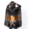 Back view of model wearing hooded poncho with image of Bigfoot, in rust and brown with geometric pattern on hood and down sides