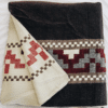 Dark Brown and Burgundy Native Queen Andean Cross blanket folded open to show cream color reverse