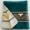 Native Queen Blanket in teal with gold Andean Cross design, folded to show cream colored reverse