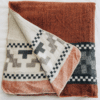 Rust and Navy Blue Andean Cross Native Queen Blanket, folded to show cream reverse side