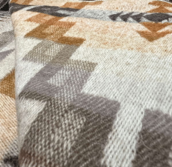 Closeup of soft textured natural colors 40% alpaca queen size blanket